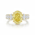 My Store 4 18K solid gold engagement ring featuring a large oval fancy yellow lab diamond with side accent stones.
