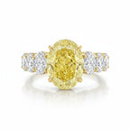 My Store 4 18K solid gold engagement ring featuring a large oval fancy yellow lab diamond with side accent stones.