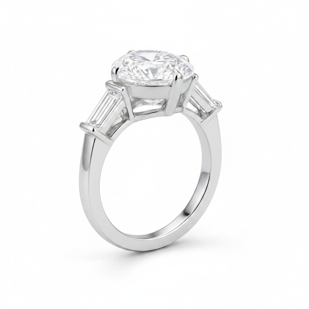 My Store 4 pear cut engagement ring with tapered baguette side diamonds in polished white gold on a white background.