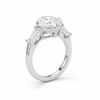 My Store 4 pear cut engagement ring with tapered baguette side diamonds in polished white gold on a white background.