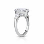 My Store 4 pear cut engagement ring with tapered baguette side stones in polished white gold, side profile view.
