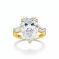 My Store 4 pear cut engagement ring with tapered baguette side diamonds in polished yellow gold