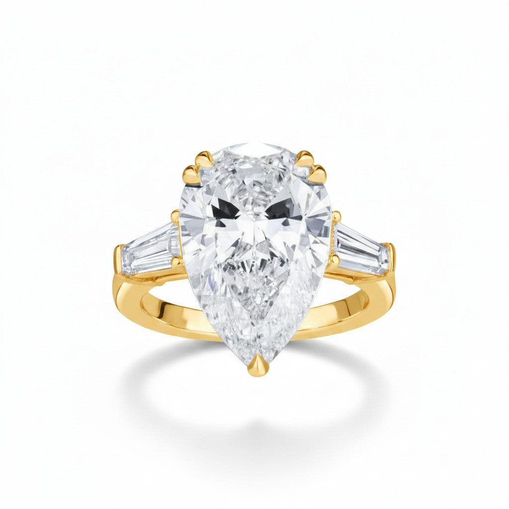 My Store 4 pear cut engagement ring with tapered baguette side diamonds in polished yellow gold
