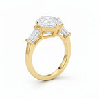 My Store 4 three-stone engagement ring with a pear-cut center diamond and tapered baguette side stones in yellow gold.