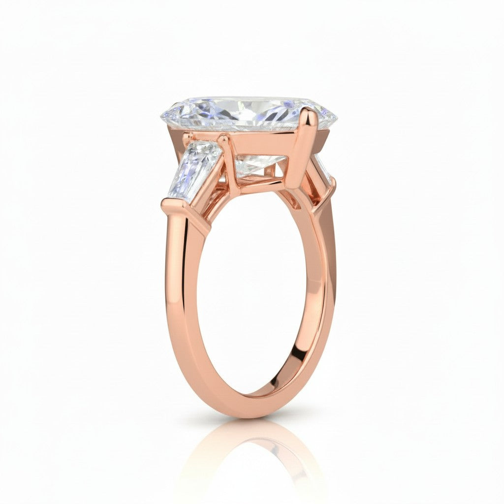 My Store 4 pear cut engagement ring with tapered baguette side stones in polished rose gold, side profile view.