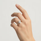 My Store 4 pear cut chevron pavé engagement ring in 18K yellow gold on a woman's finger with a tiara-inspired silhouette.