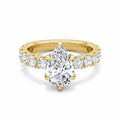 My Store 4 pear cut diamond engagement ring with a five-prong setting and shared-prong accent band in yellow gold.
