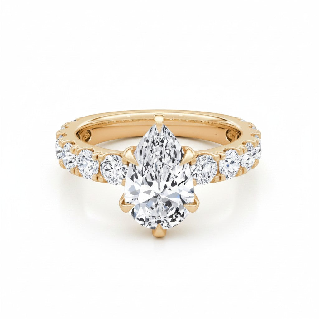 My Store 4 pear cut diamond engagement ring in 18K yellow gold with a shared-prong accent band and five-prong setting.