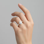 My Store 4 pear cut diamond engagement ring with a pavé band and hidden halo on a woman's finger in yellow gold