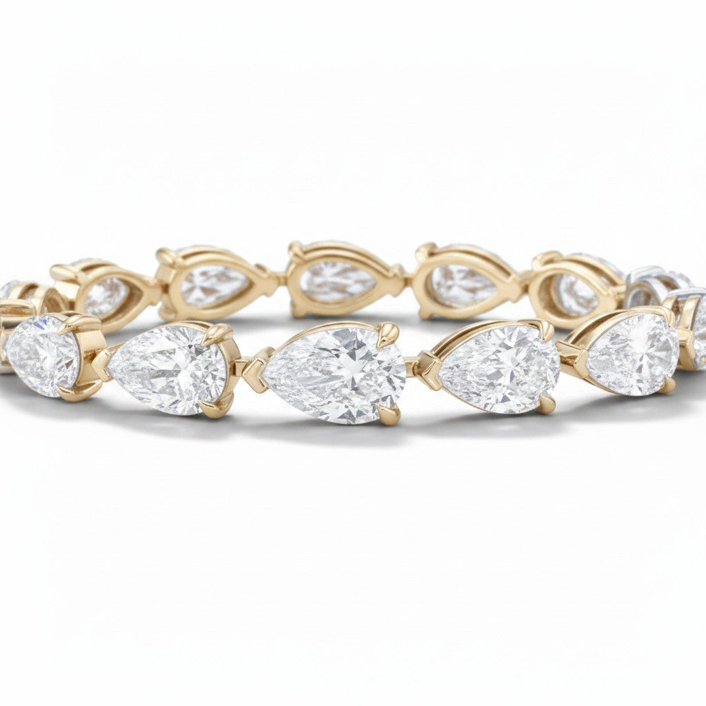 My Store 4 pear cut diamond tennis bracelet in yellow gold with a continuous line of brilliant teardrop gemstones