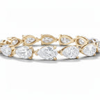 My Store 4 pear cut diamond tennis bracelet in yellow gold with a continuous line of brilliant teardrop gemstones
