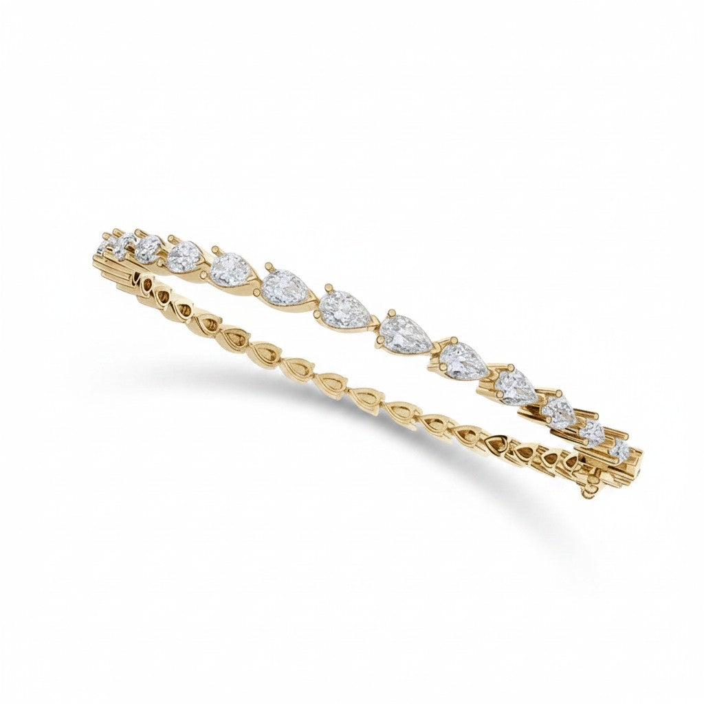 My Store 4 pear cut diamond tennis bracelet in 14K yellow gold with a secure box clasp and fluid link design.
