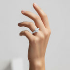 My Store 4 vintage-inspired pear cut three-stone engagement ring with engraved gold band on a woman's hand