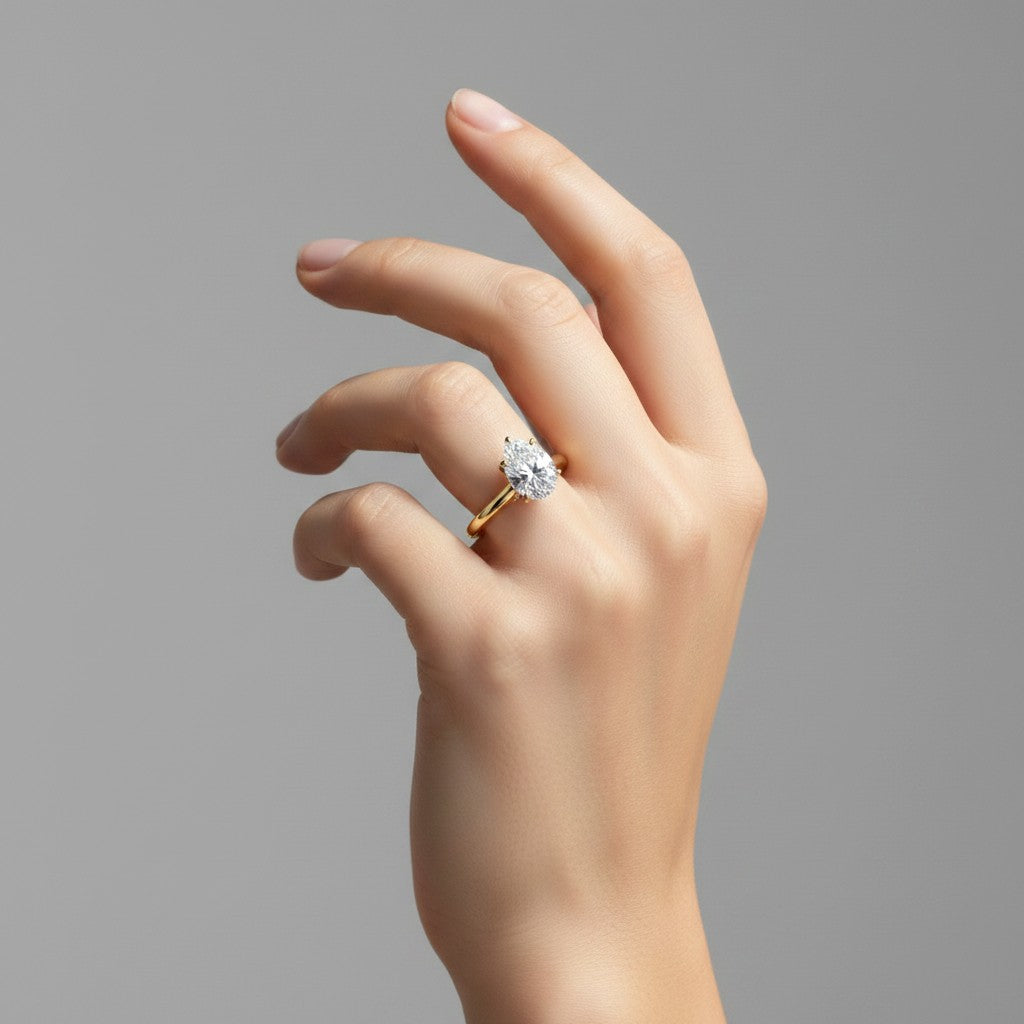 My Store 4 pear cut diamond engagement ring with a hidden halo and cathedral bridge on a yellow gold band.