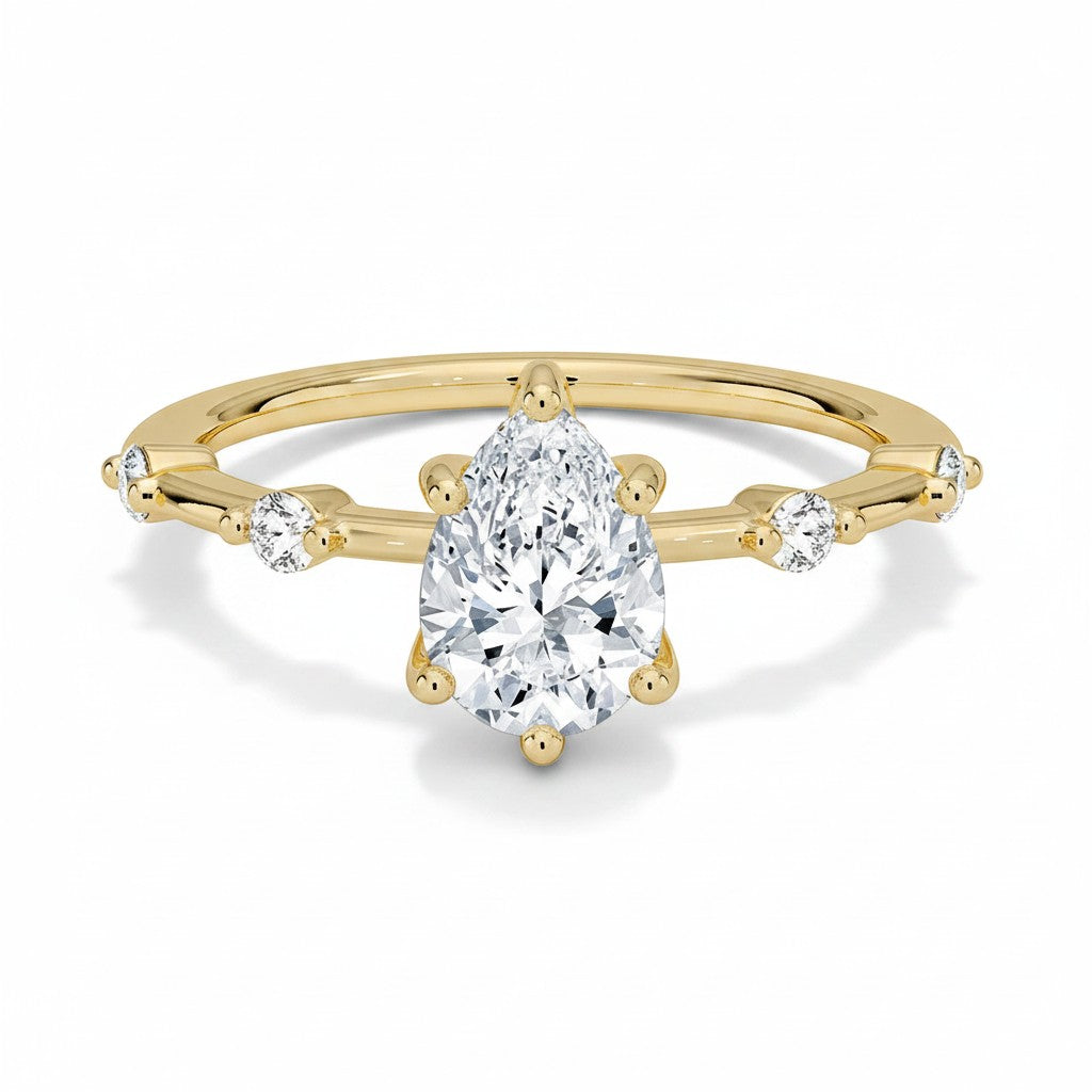 My Store 4 pear cut engagement ring in 18K yellow gold with a station accent band and five-prong setting
