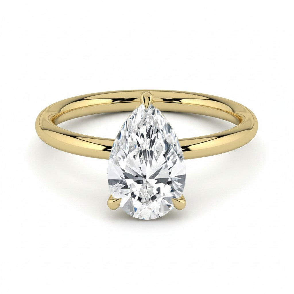 My Store 4 pear cut diamond solitaire engagement ring with a hidden halo on a polished 18k yellow gold band