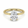 My Store 4 pear cut diamond solitaire engagement ring with a hidden halo on a polished 18k yellow gold band