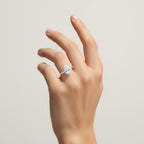 My Store 4 pear cut diamond engagement ring with a micro-pavé band on a hand, featuring a six-prong yellow gold setting.