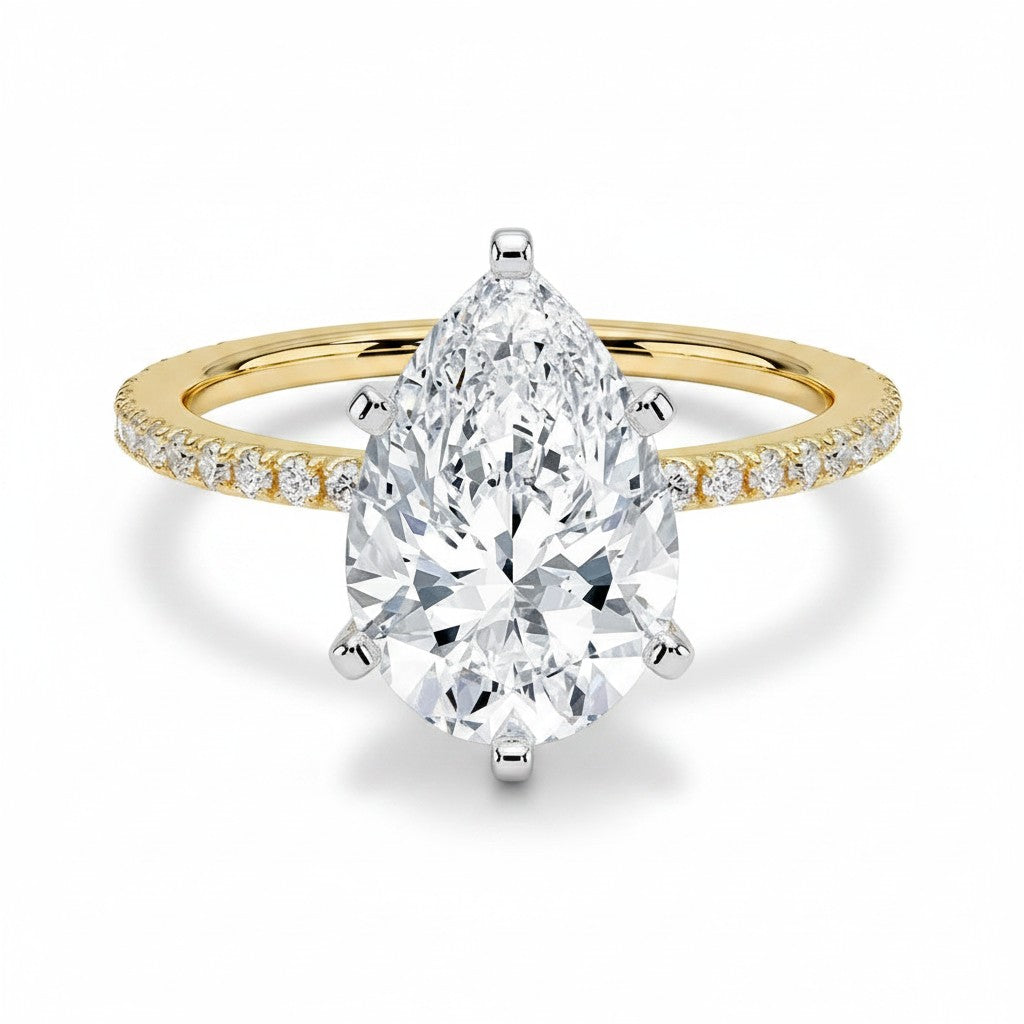 My Store 4 pear cut diamond engagement ring with a micro-pavé band and six-prong white gold setting in yellow gold.