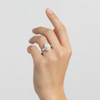 My Store 4 three-stone engagement ring with a pear-cut center diamond and tapered baguette side stones in white gold.