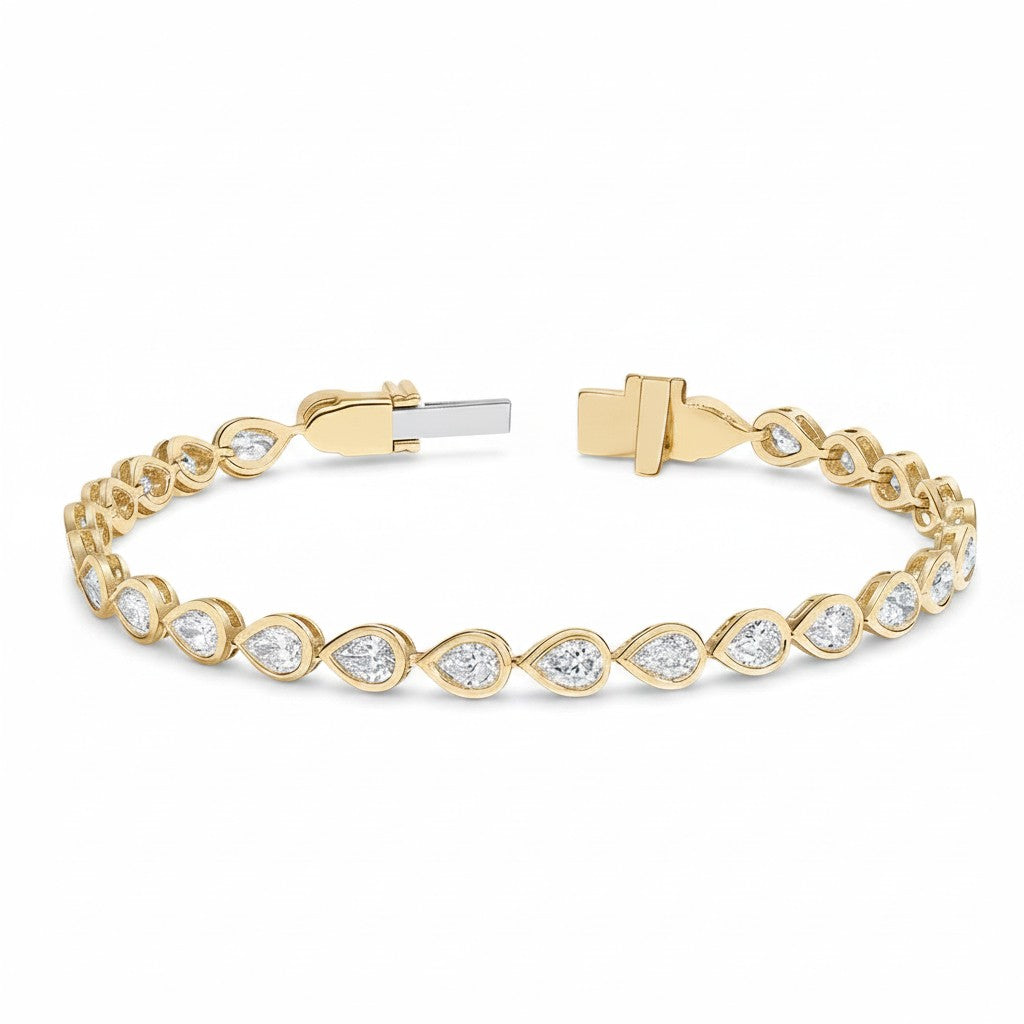 My Store 4 pear cut diamond tennis bracelet in yellow gold with a secure box clasp and smooth bezel settings.