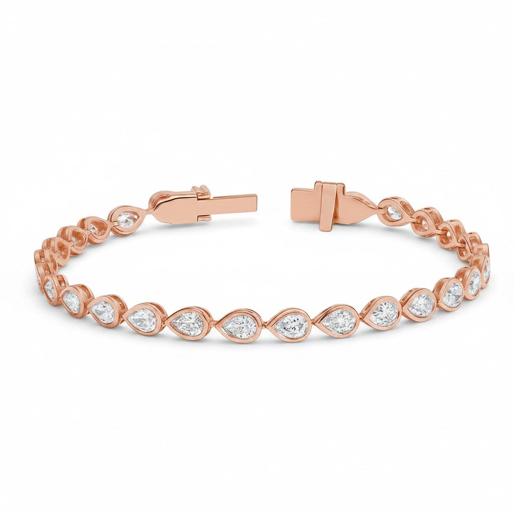 My Store 4 rose gold tennis bracelet featuring pear-cut diamonds in smooth protective bezel settings with a box clasp.