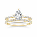 My Store 4 pear-cut diamond engagement ring and matching pavé wedding band set in 18K yellow gold.