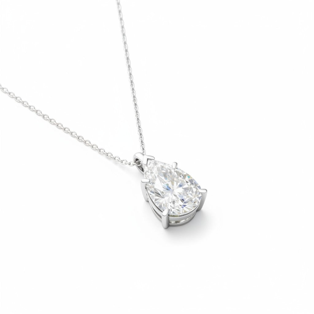 My Store 4 pear-cut diamond solitaire pendant necklace on a delicate white gold chain against a white background