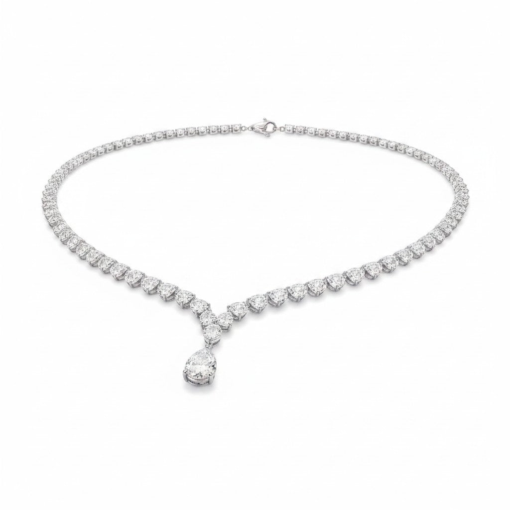 My Store 4 graduated pear diamond tennis necklace in white gold with a central teardrop pendant on a white background.