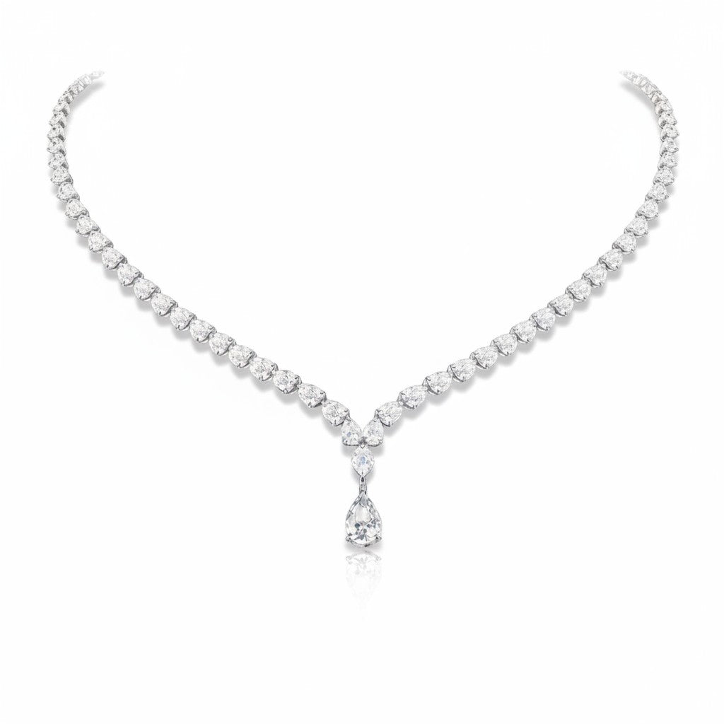 My Store 4 graduated pear-cut diamond tennis necklace in white gold with a central teardrop pendant on a white background