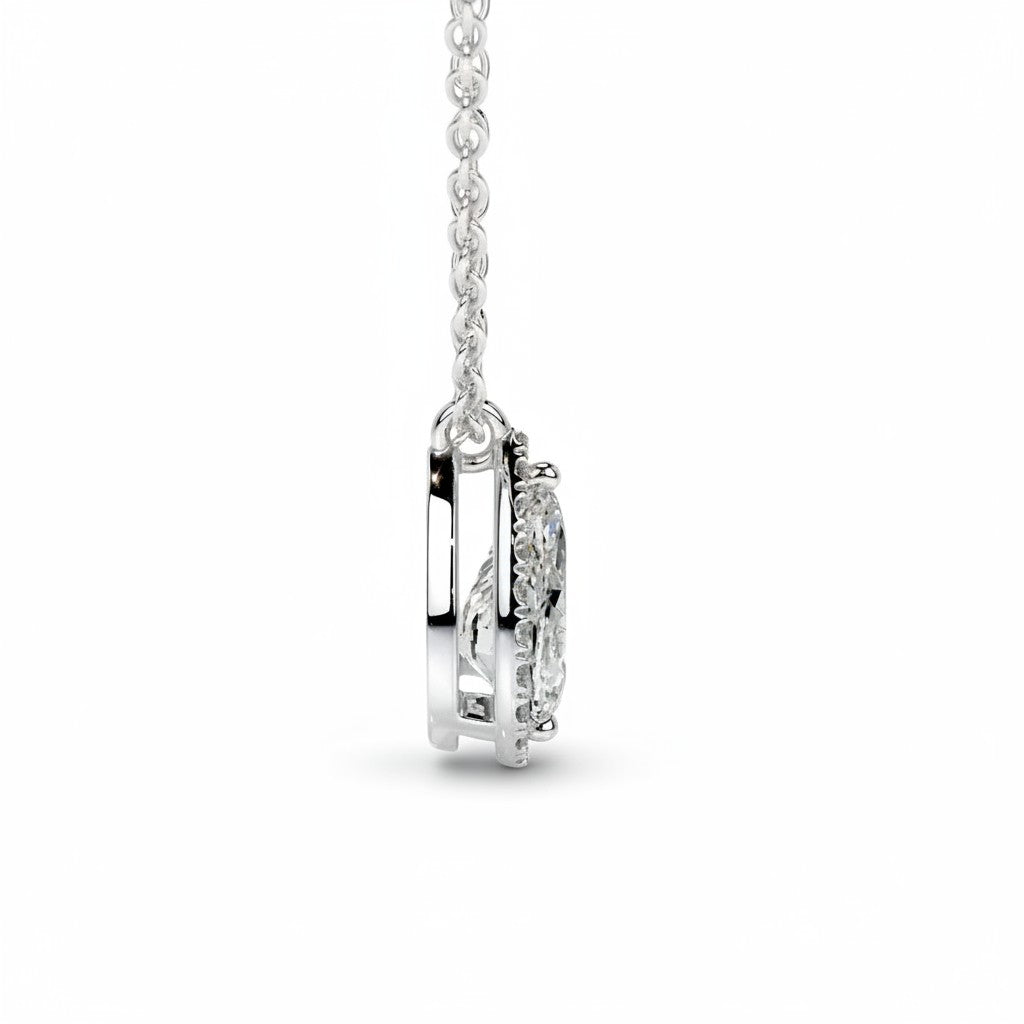 My Store 4 pear halo floating diamond pendant necklace in white gold with a delicate cable chain side view.