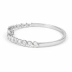 My Store 4 open bangle bracelet in white gold featuring alternating pear and heart cut diamonds in a bypass design.
