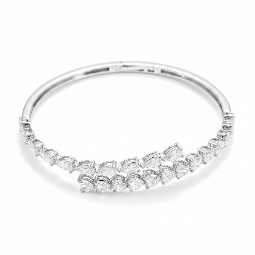 My Store 4 bypass open bangle bracelet featuring pear and heart cut diamonds set in polished white gold with a hinge.