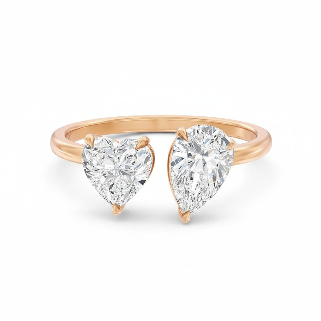 My Store 4 18K solid gold Toi et Moi ring featuring a pear-cut and heart-cut lab-grown diamond on a polished band.