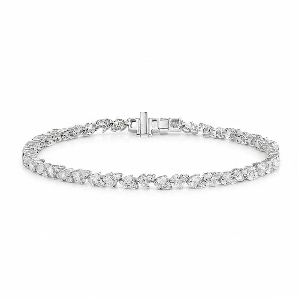 My Store 4 tennis bracelet featuring alternating pear and round diamonds set in polished white gold with a box clasp.