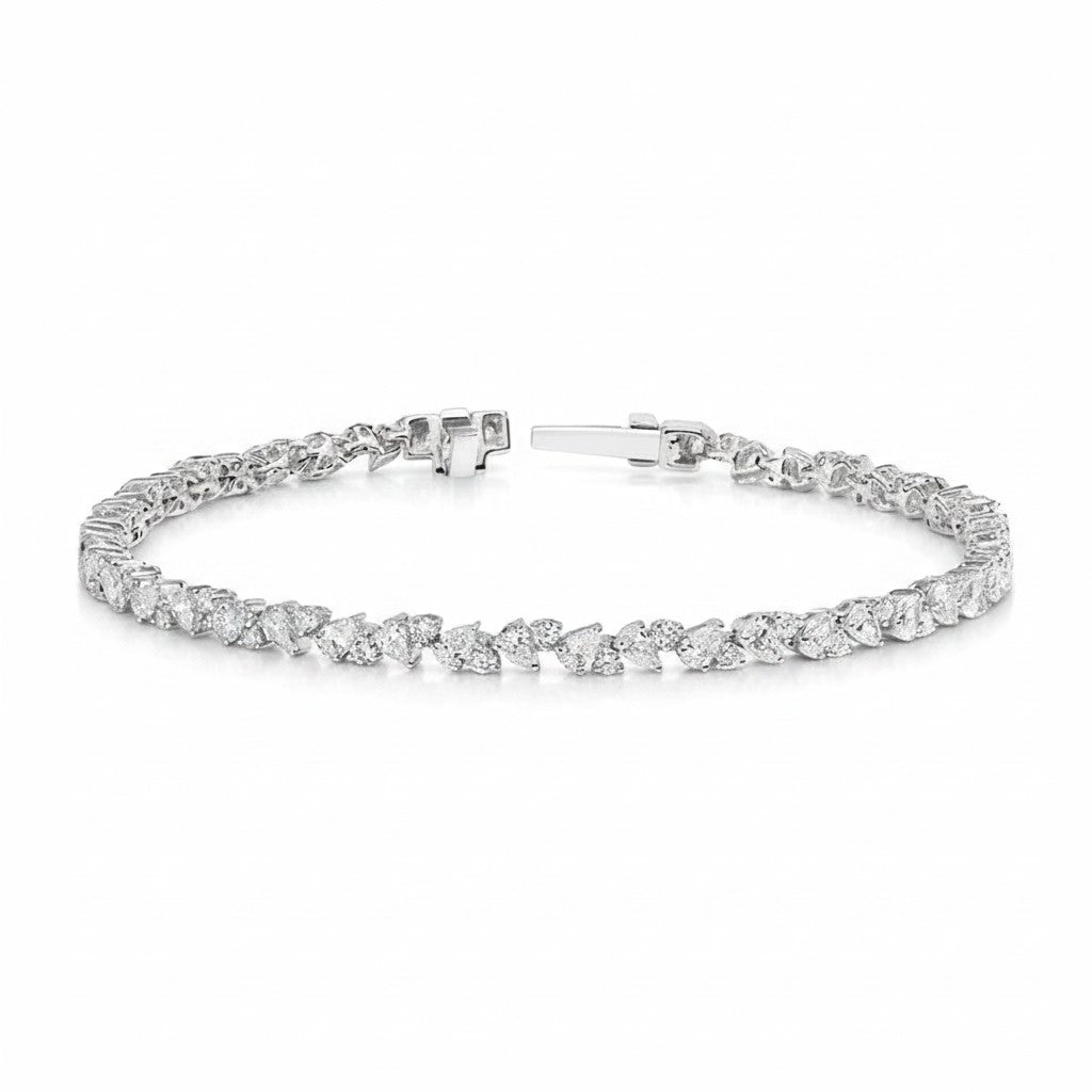My Store 4 tennis bracelet featuring alternating pear and round cut diamonds in a solid gold articulated setting.