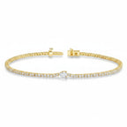 My Store 4 gold tennis bracelet featuring a continuous line of round diamonds and a central pear-cut diamond accent.