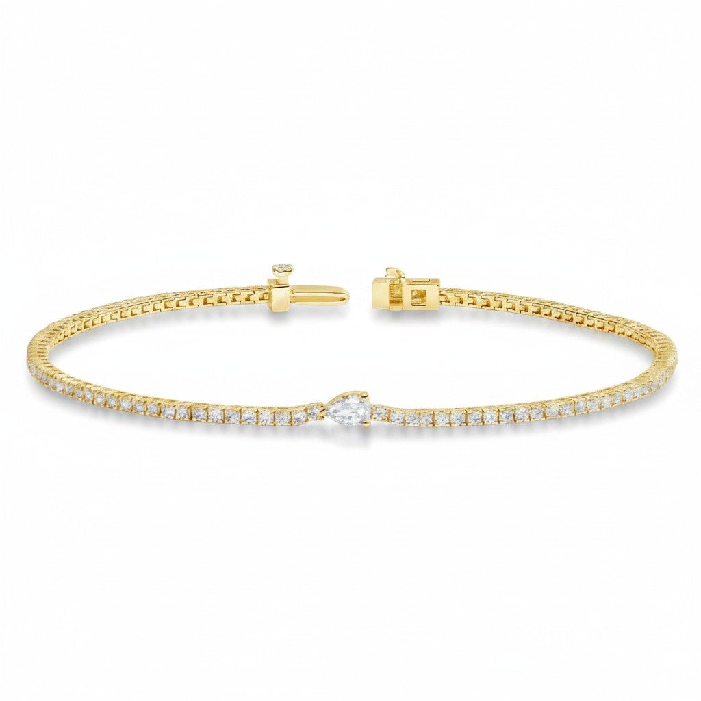 My Store 4 gold tennis bracelet featuring a continuous line of round diamonds and a central pear-cut diamond accent.