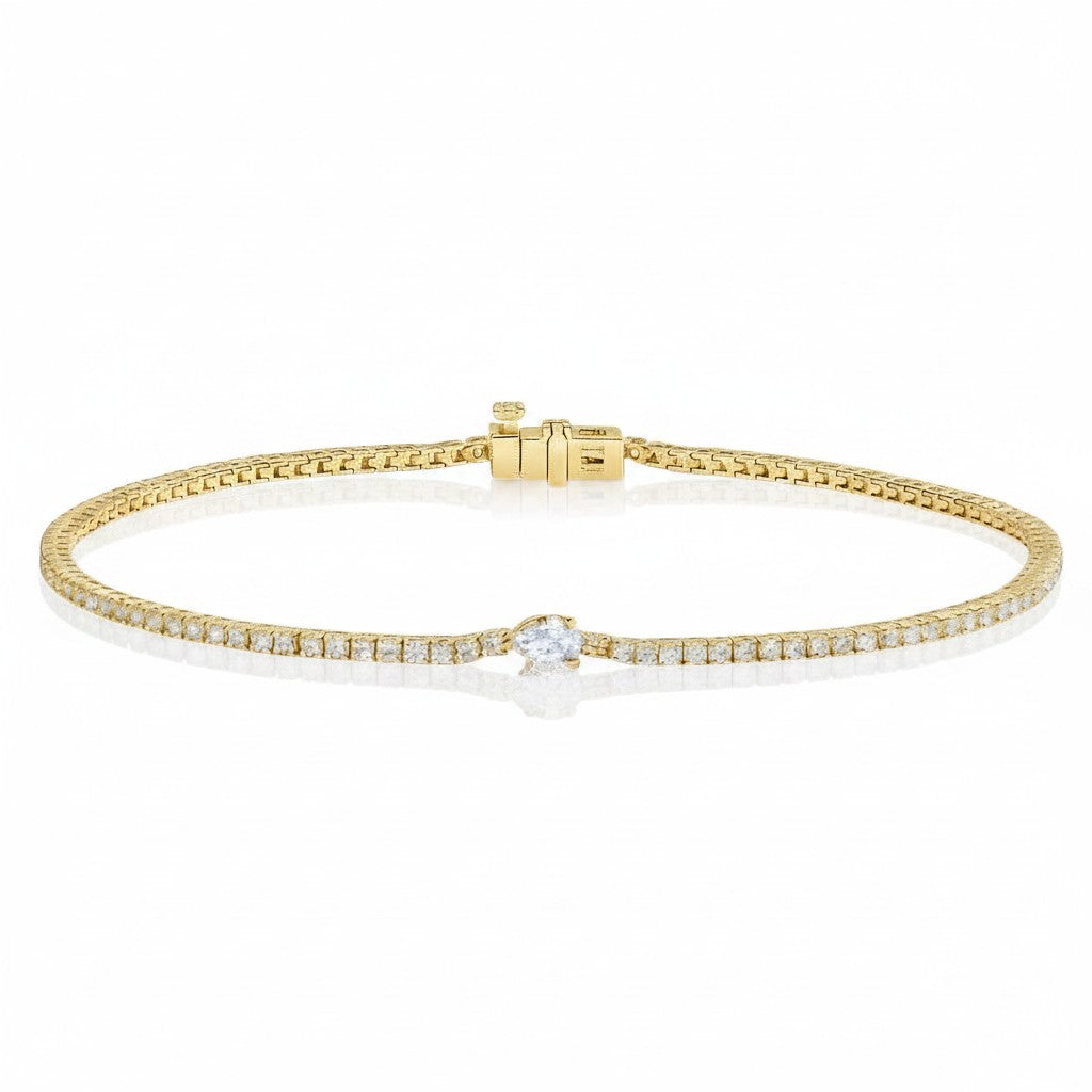 My Store 4 yellow gold tennis bracelet featuring a continuous line of round diamonds and a central pear-cut diamond.
