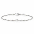 My Store 4 white gold tennis bracelet featuring a continuous line of round diamonds and a central pear-cut diamond.