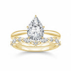 My Store 4 pear cut solitaire engagement ring with a marquise and round diamond contour band in 18K yellow gold.