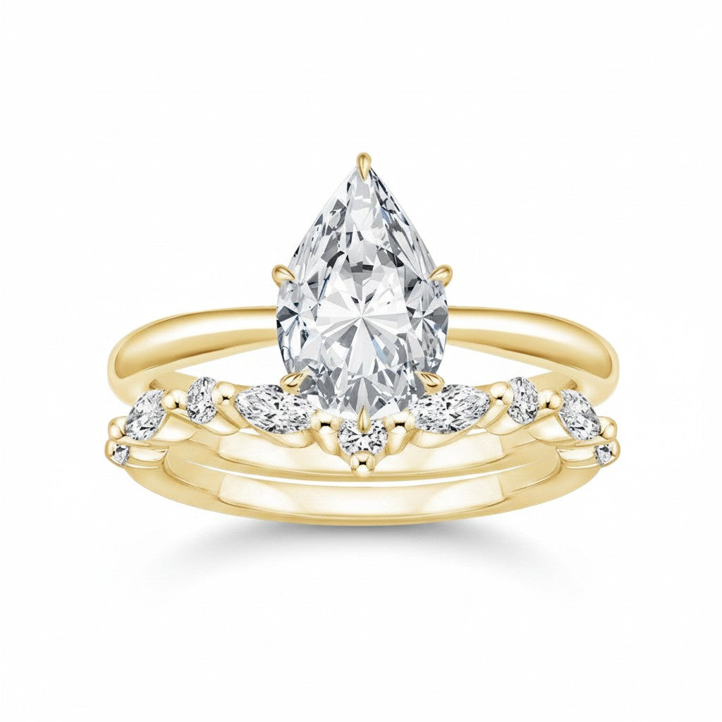 My Store 4 pear cut solitaire engagement ring with a marquise and round diamond contour band in 18K yellow gold.