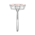 My Store 4 18K solid gold three-stone engagement ring with a pear-cut lab-grown diamond, side view.