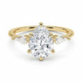 My Store 4 three-stone engagement ring with a pear-cut center diamond and pear side accents in 18K yellow gold.