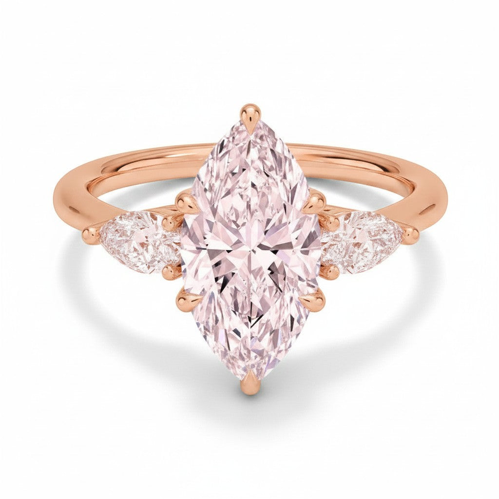 My Store 4 18K solid gold three-stone engagement ring featuring a pear-cut lab-grown diamond in a polished gold band.