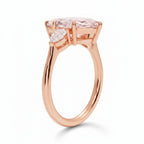 My Store 4 18K solid gold three-stone engagement ring featuring a pear-cut lab-grown diamond in a side profile view.