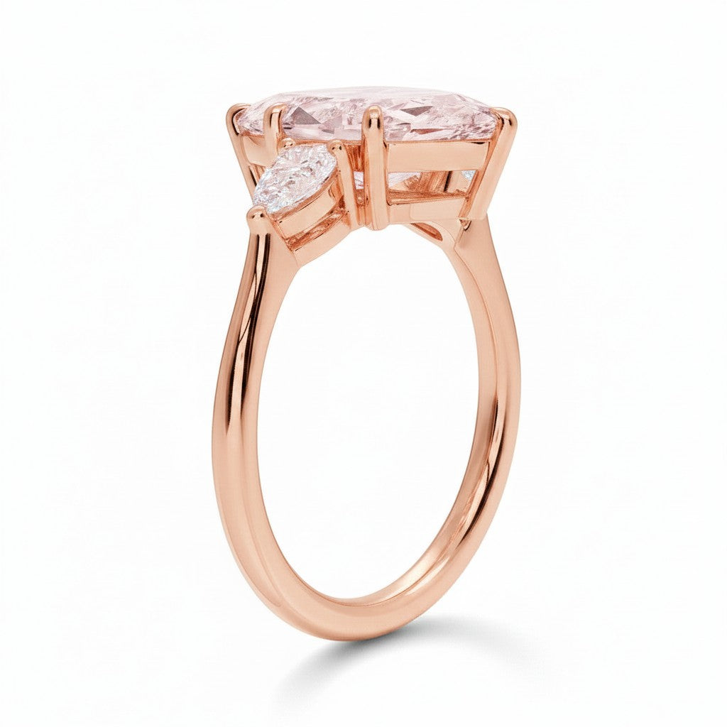 My Store 4 18K solid gold three-stone engagement ring featuring a pear-cut lab-grown diamond in a side profile view.