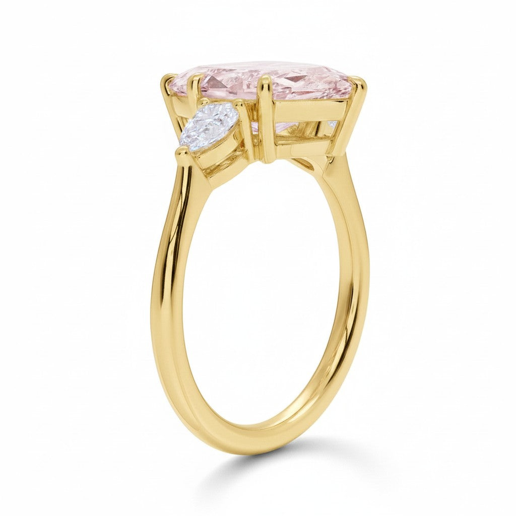 My Store 4 18K solid gold three-stone engagement ring featuring a pear-cut lab-grown diamond on a polished gold band.