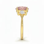 My Store 4 18K solid gold trilogy ring featuring a pear-cut fancy pink lab diamond with side stones, side profile view