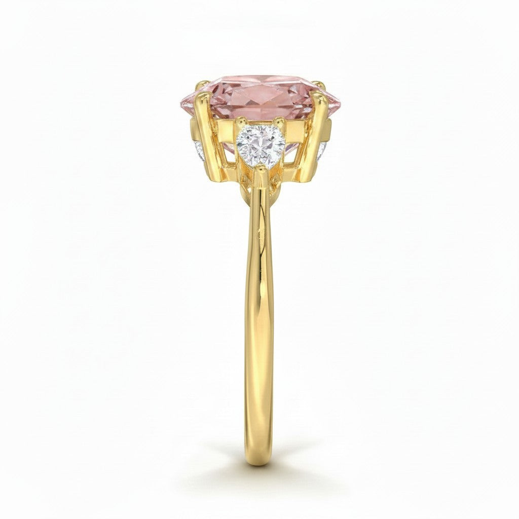 My Store 4 18K solid gold trilogy ring featuring a pear-cut fancy pink lab diamond with side stones, side profile view